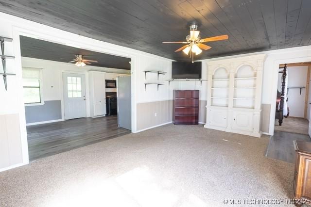 604 N N W, Konawa, OK 74849 - unfurnished living room with ceiling fan, wooden ceiling, and carpet flooring