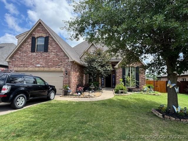 2511 E 138th St S, Bixby, OK 74008 - view of front of home with brick siding, a garage, and driveway