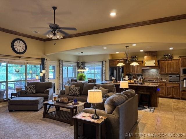 2511 E 138th St S, Bixby, OK 74008 - living area featuring crown molding, ceiling fan, recessed lighting, a chandelier, and light tile patterned flooring