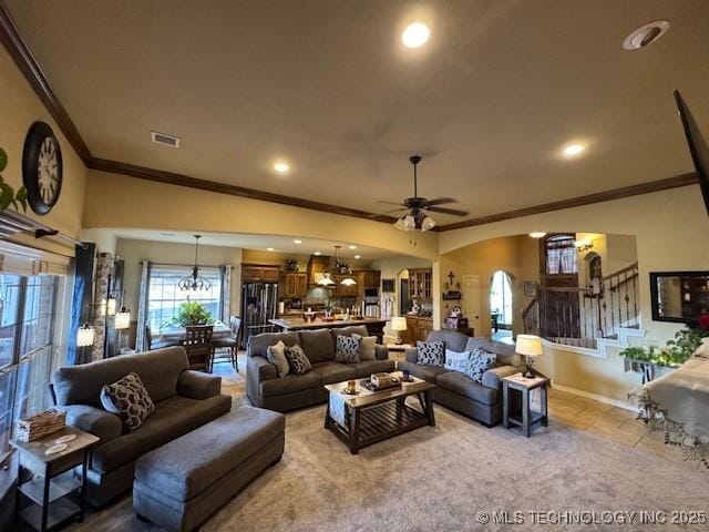 2511 E 138th St S, Bixby, OK 74008 - carpeted living area with ornamental molding, ceiling fan, stairs, a chandelier, and recessed lighting