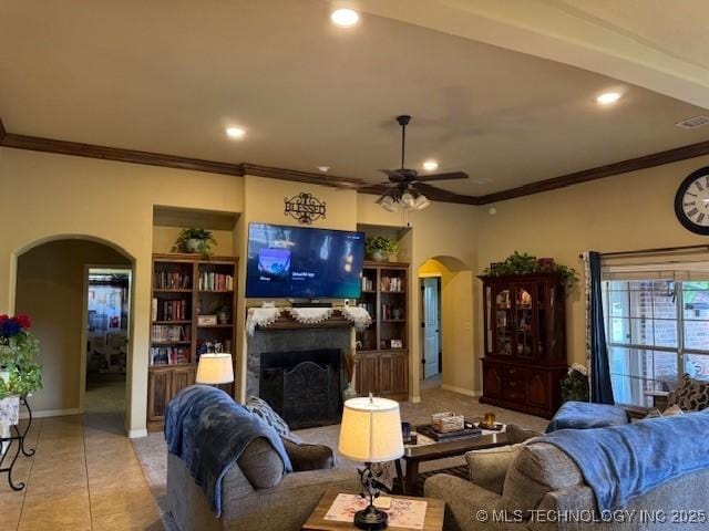 2511 E 138th St S, Bixby, OK 74008 - living area with arched walkways, a fireplace, a ceiling fan, ornamental molding, and recessed lighting