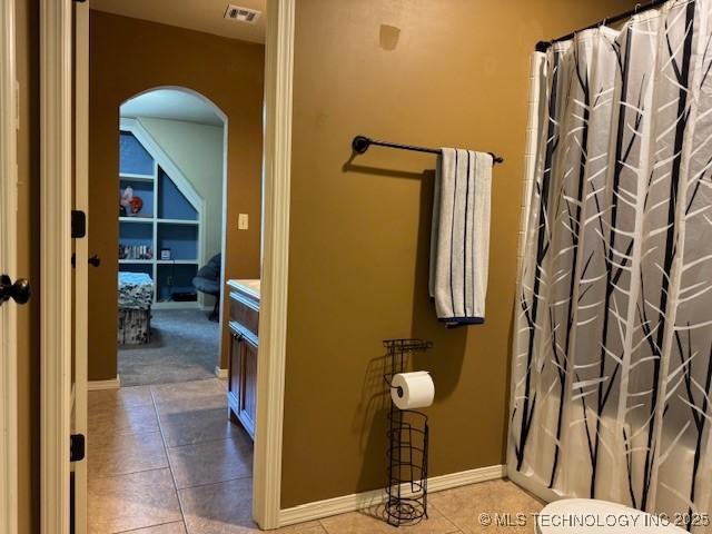 2511 E 138th St S, Bixby, OK 74008 - full bath featuring tile patterned floors, a shower with shower curtain, and vanity
