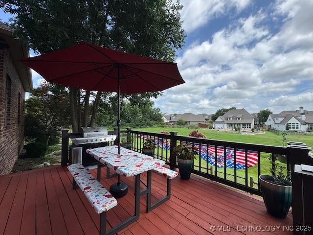 2511 E 138th St S, Bixby, OK 74008 - deck featuring a residential view, a lawn, grilling area, and outdoor dining area