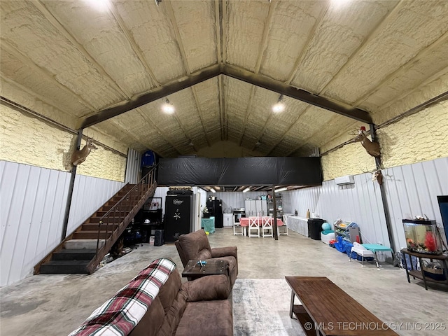 557 High Point Ln, Skiatook, OK 74070 - living area featuring concrete flooring and vaulted ceiling