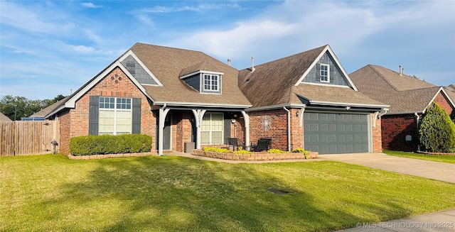 10219 N 119th E Ave, Owasso, OK 74055 - view of front facade featuring brick siding, concrete driveway, a shingled roof, and a garage