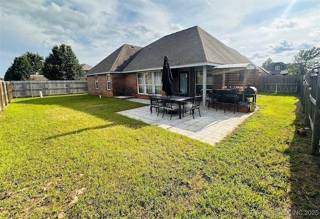 10219 N 119th E Ave, Owasso, OK 74055 - rear view of property featuring brick siding, a patio area, a fenced backyard, and roof with shingles