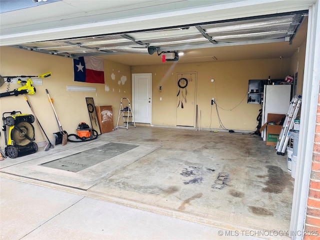 10219 N 119th E Ave, Owasso, OK 74055 - garage featuring a garage door opener