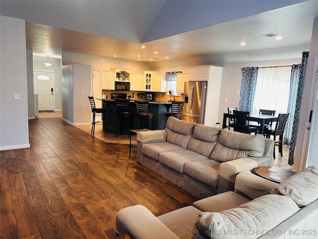 10219 N 119th E Ave, Owasso, OK 74055 - living room featuring dark wood-style floors, vaulted ceiling, and recessed lighting