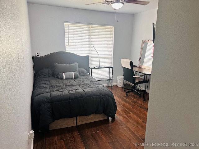 10219 N 119th E Ave, Owasso, OK 74055 - bedroom featuring wood finished floors, a textured wall, and a ceiling fan