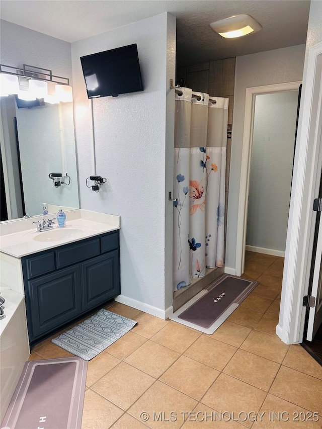 10219 N 119th E Ave, Owasso, OK 74055 - bathroom featuring a shower stall, tile patterned flooring, and vanity