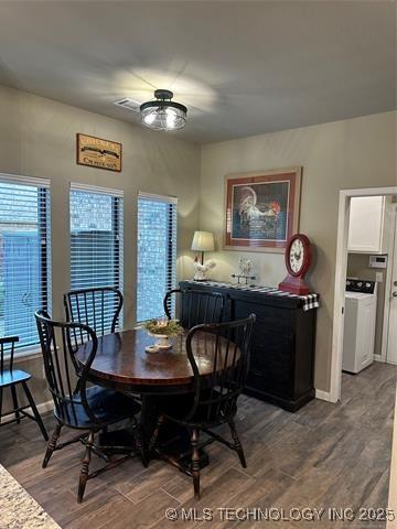 1821 W Lincoln St N, Broken Arrow, OK 74012 - dining area featuring washer / dryer and dark wood finished floors