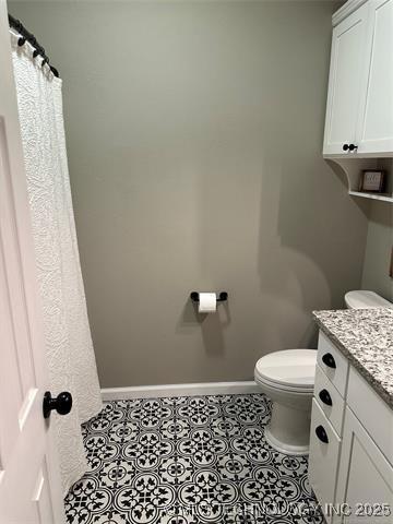 1821 W Lincoln St N, Broken Arrow, OK 74012 - bathroom with vanity and tile patterned floors