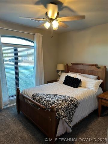 1821 W Lincoln St N, Broken Arrow, OK 74012 - carpeted bedroom with a ceiling fan