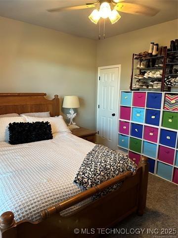 1821 W Lincoln St N, Broken Arrow, OK 74012 - carpeted bedroom with a ceiling fan