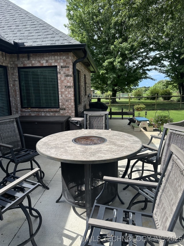 1821 W Lincoln St N, Broken Arrow, OK 74012 - view of patio / terrace with a fire pit