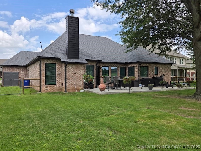 1821 W Lincoln St N, Broken Arrow, OK 74012 - rear view of house featuring brick siding, a patio area, a chimney, a shingled roof, and a gate