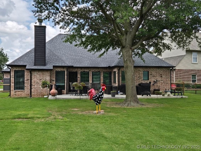 1821 W Lincoln St N, Broken Arrow, OK 74012 - rear view of house with a patio, brick siding, roof with shingles, and a chimney