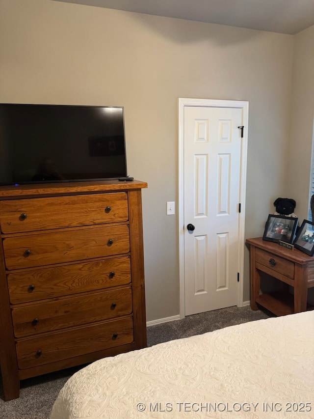1821 W Lincoln St N, Broken Arrow, OK 74012 - bedroom featuring dark colored carpet and baseboards