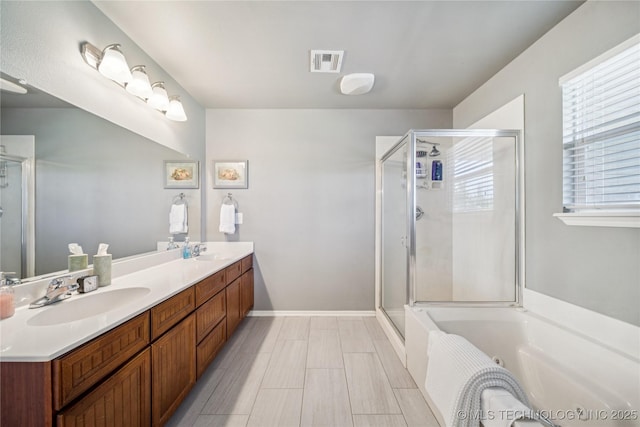 11710 S Willow St, Jenks, OK 74037 - bathroom featuring a jetted tub, a shower stall, and double vanity