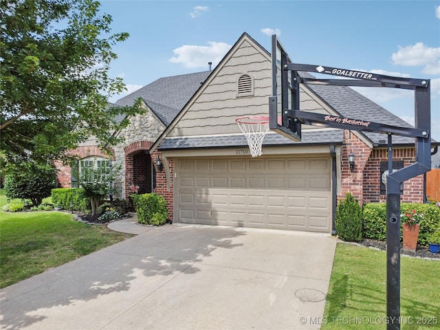 11710 S Willow St, Jenks, OK 74037 - view of front of house featuring brick siding, a shingled roof, concrete driveway, and a front lawn