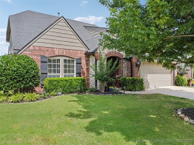 11710 S Willow St, Jenks, OK 74037 - view of front facade with brick siding, a shingled roof, a front lawn, and concrete driveway