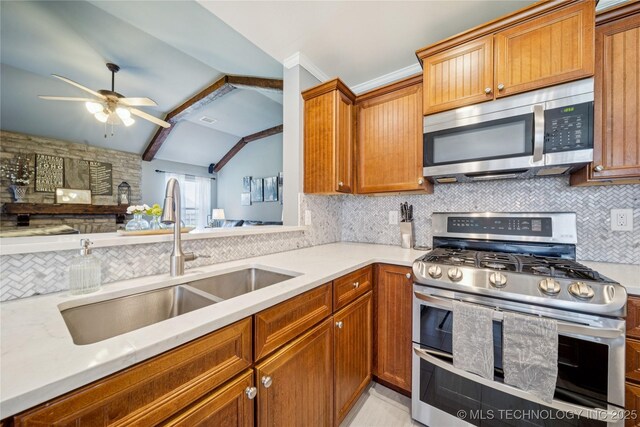 11710 S Willow St, Jenks, OK 74037 - kitchen featuring appliances with stainless steel finishes, backsplash, light countertops, and a ceiling fan