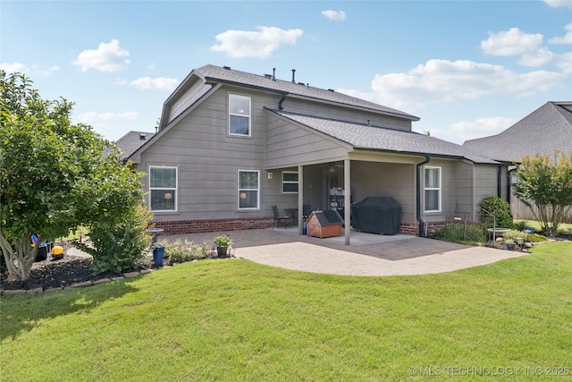 11710 S Willow St, Jenks, OK 74037 - rear view of house featuring a patio, a lawn, and brick siding