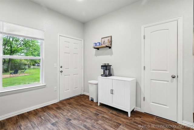 1325 Houston, Durant, OK 74701 - foyer featuring dark wood finished floors and baseboards