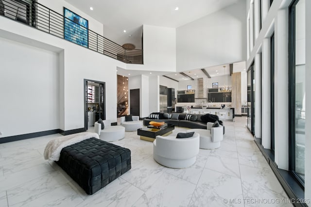 1226 W 109th Pl S, Jenks, OK 74037 - living room featuring light marble finish flooring and a towering ceiling