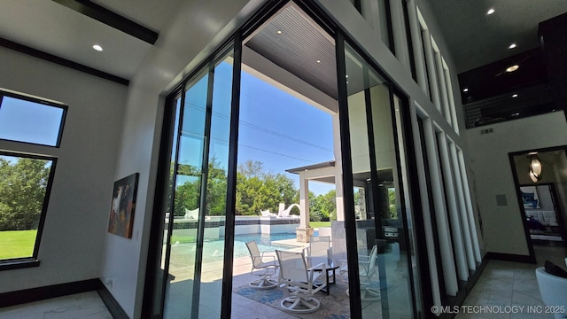 1226 W 109th Pl S, Jenks, OK 74037 - doorway to outside featuring a towering ceiling, recessed lighting, and marble finish floors