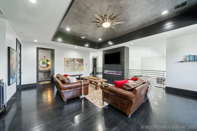 1226 W 109th Pl S, Jenks, OK 74037 - living room featuring wood finished floors, a raised ceiling, and recessed lighting