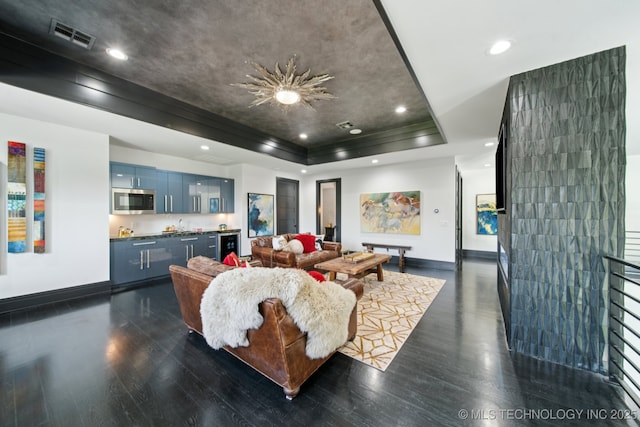 1226 W 109th Pl S, Jenks, OK 74037 - living room featuring a raised ceiling, dark wood-style floors, recessed lighting, and crown molding