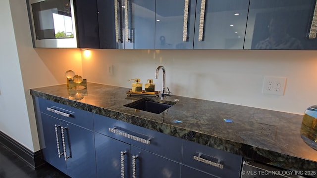 1226 W 109th Pl S, Jenks, OK 74037 - kitchen featuring blue cabinets, modern cabinets, and dark stone counters