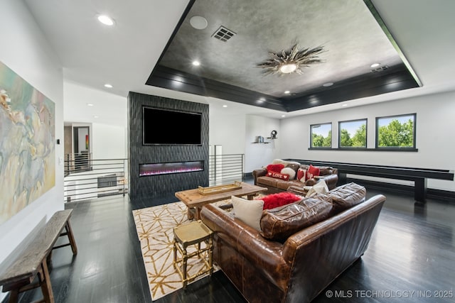 1226 W 109th Pl S, Jenks, OK 74037 - living room featuring a raised ceiling, wood finished floors, a fireplace, and recessed lighting