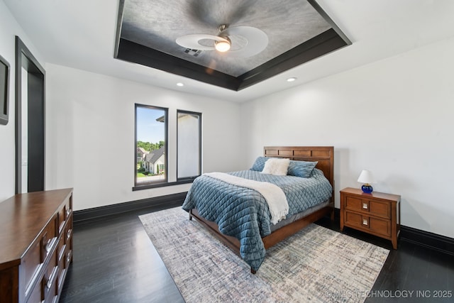 1226 W 109th Pl S, Jenks, OK 74037 - bedroom with a raised ceiling, dark wood-style flooring, ceiling fan, and recessed lighting