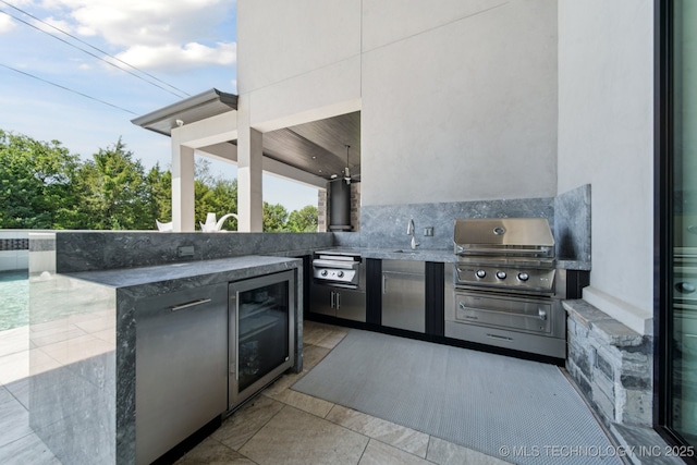 1226 W 109th Pl S, Jenks, OK 74037 - view of patio with an outdoor kitchen and beverage cooler