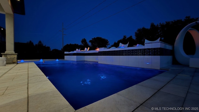 1226 W 109th Pl S, Jenks, OK 74037 - pool at twilight with an outdoor pool and a patio area