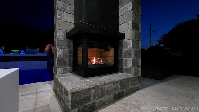 1226 W 109th Pl S, Jenks, OK 74037 - detailed view of a warm lit fireplace