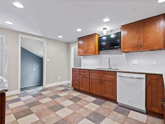 1322 Boundary Ave, Pawhuska, OK 74056 - kitchen featuring dishwasher, brown cabinetry, recessed lighting, light stone finish flooring, and light stone countertops