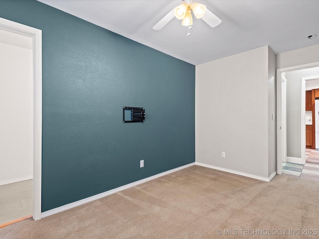 1322 Boundary Ave, Pawhuska, OK 74056 - carpeted empty room featuring ceiling fan and fire sprinkler in ceiling