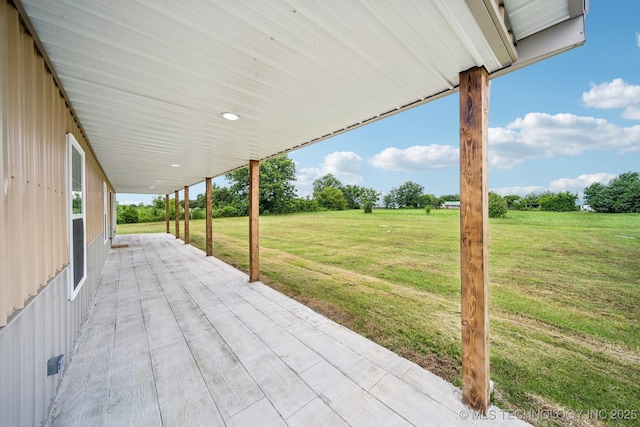 1102 W Main St, Beggs, OK 74421 - wooden deck featuring a patio area and a lawn