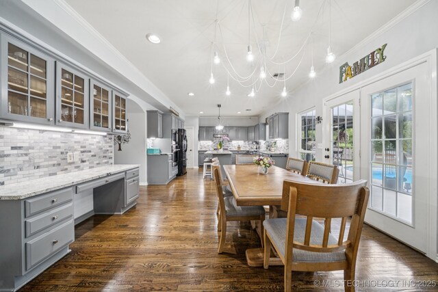 3701 W Dallas St, Broken Arrow, OK 74012 - dining room with built in study area, dark wood-style floors, recessed lighting, and ornamental molding