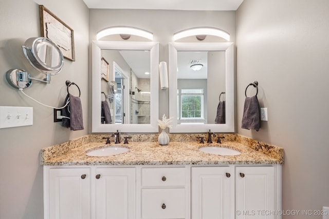 3701 W Dallas St, Broken Arrow, OK 74012 - bathroom featuring double vanity and a walk in shower