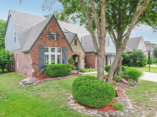 3701 W Dallas St, Broken Arrow, OK 74012 - tudor-style house with brick siding and a shingled roof