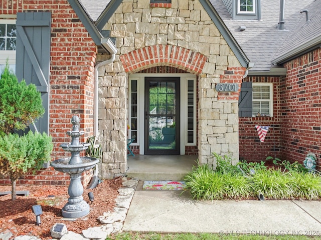 3701 W Dallas St, Broken Arrow, OK 74012 - property entrance with a shingled roof, brick siding, and stone siding