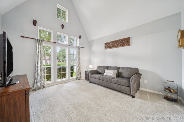 3701 W Dallas St, Broken Arrow, OK 74012 - carpeted living area with high vaulted ceiling and baseboards