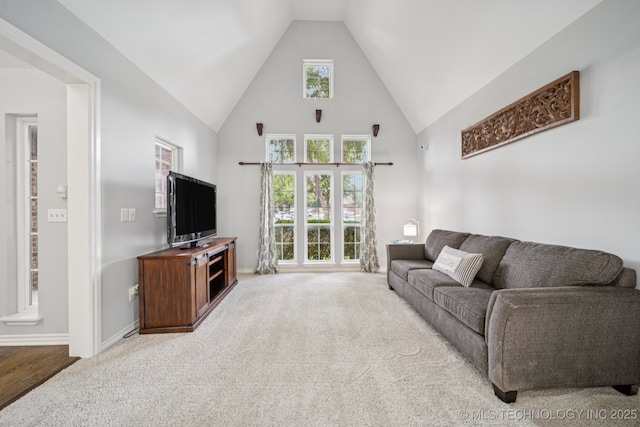 3701 W Dallas St, Broken Arrow, OK 74012 - living room featuring carpet floors and high vaulted ceiling