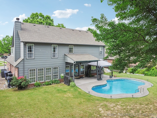 3701 W Dallas St, Broken Arrow, OK 74012 - rear view of property featuring a patio area, a chimney, an outdoor pool, brick siding, and a shingled roof