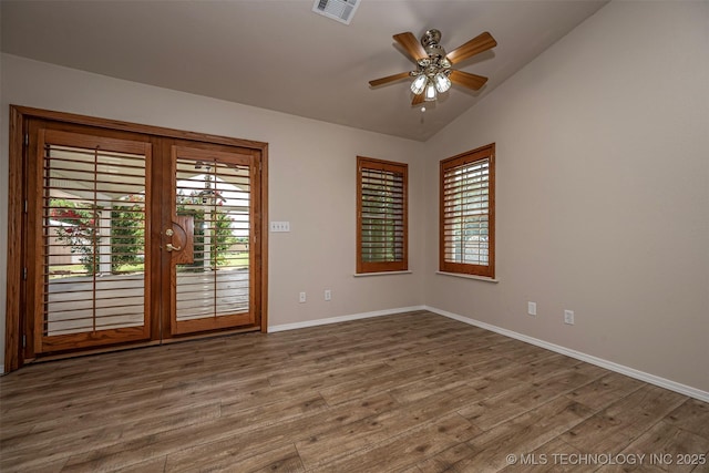 710 N Brethren Rd, Cushing, OK 74023 - empty room with vaulted ceiling, wood finished floors, and ceiling fan