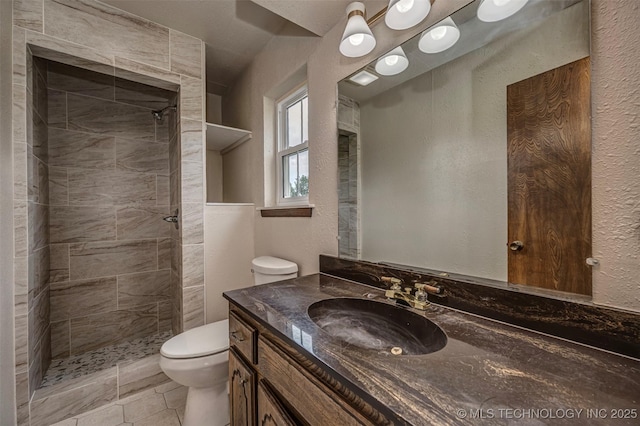 710 N Brethren Rd, Cushing, OK 74023 - bathroom featuring vanity, a tile shower, and a textured wall
